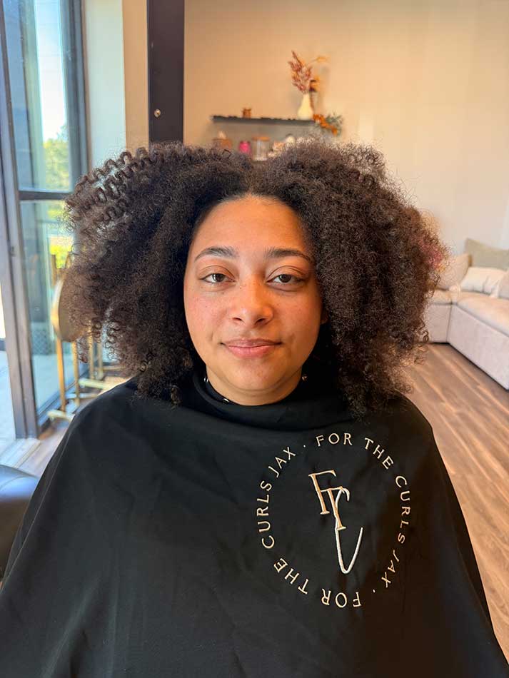 Woman sitting in salon chair