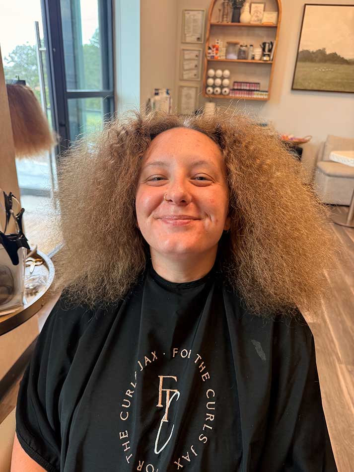 Jacksonvile curly hair extensions client in the salon